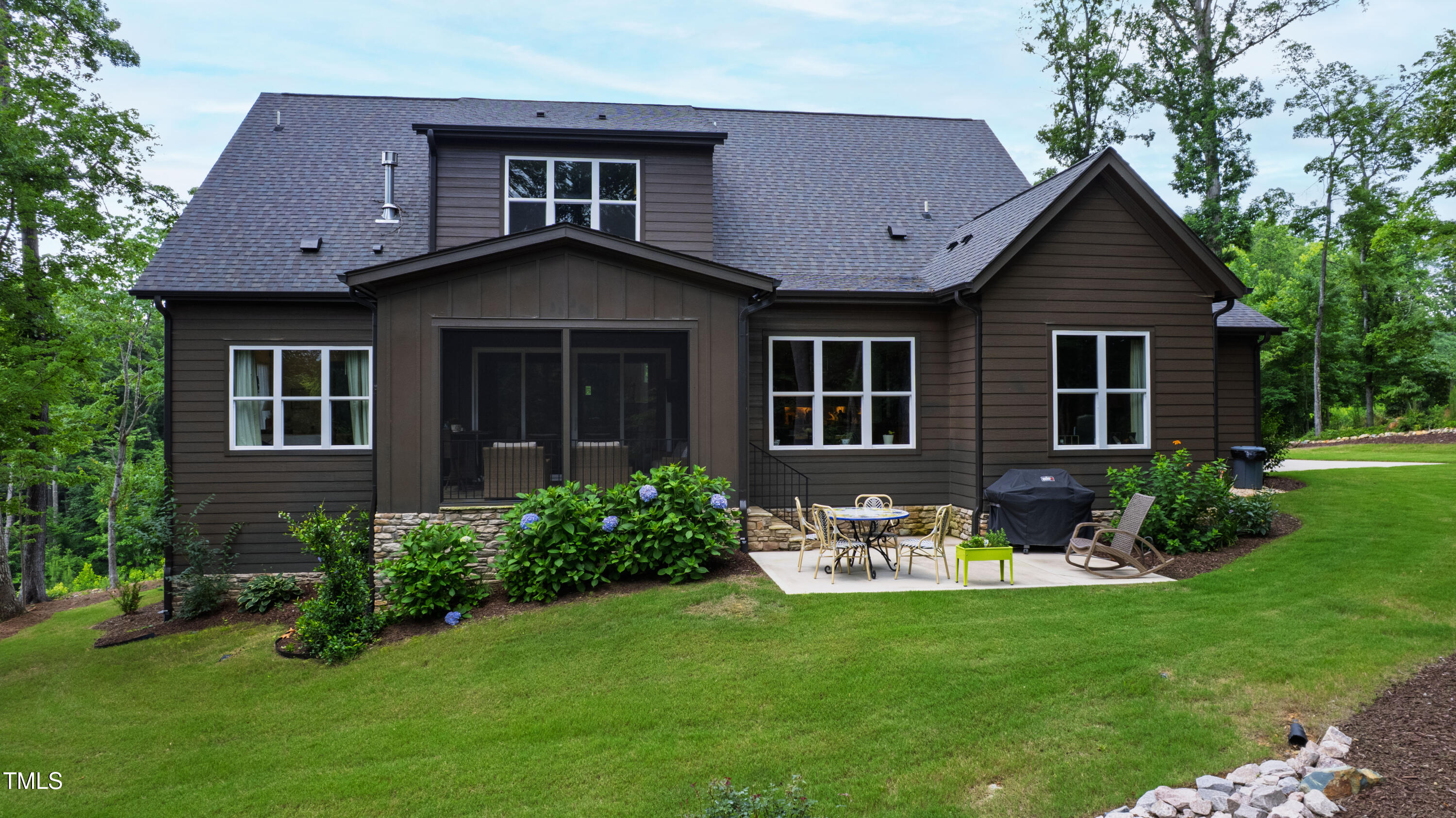 541 Sunset Grove Drive Pittsboro, NC 27312 - Photo 61 of 75 a front view of a house with a yard and trees