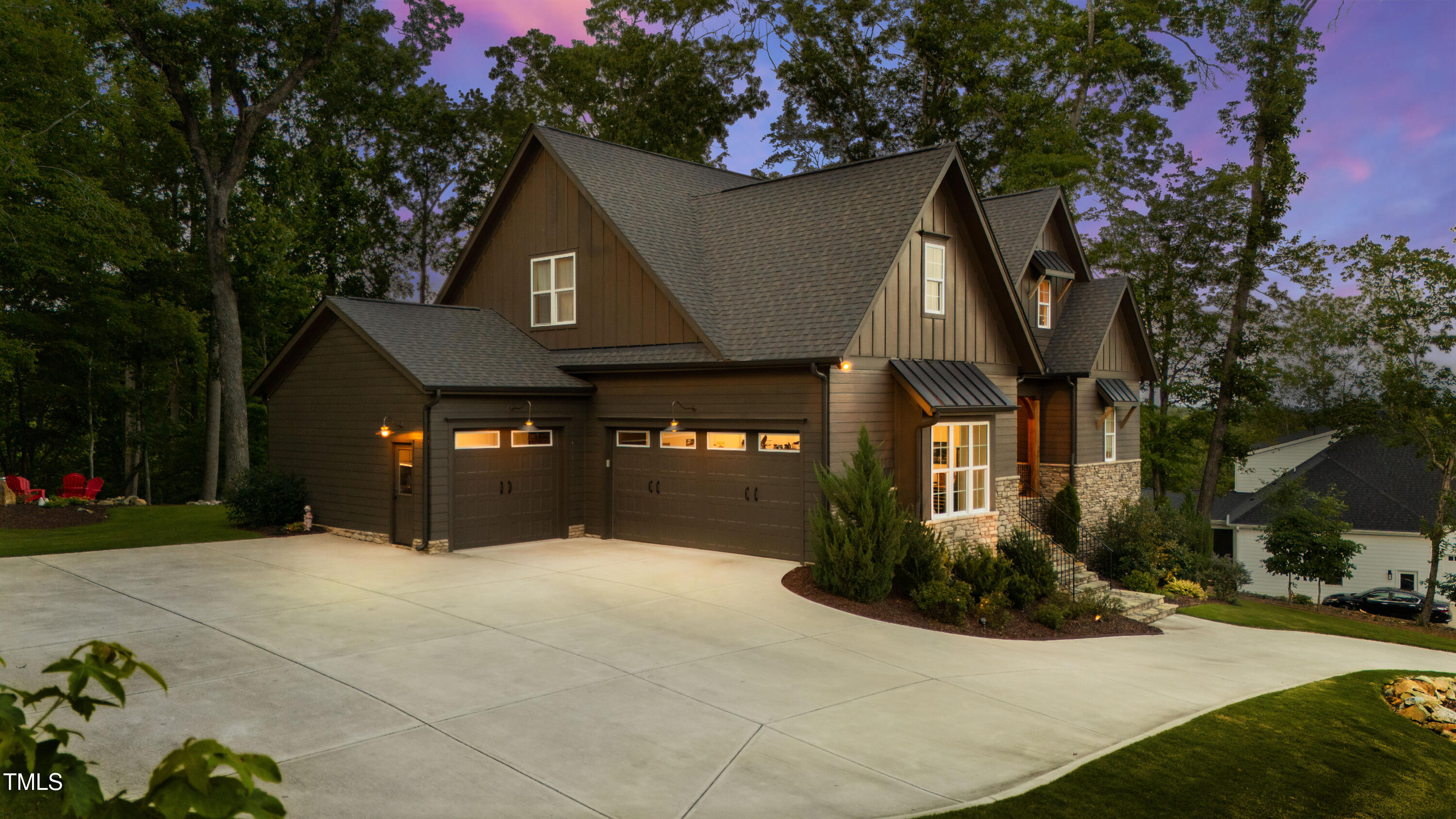 541 Sunset Grove Drive Pittsboro, NC 27312 - Photo 62 of 75 a front view of a house with a yard and garage