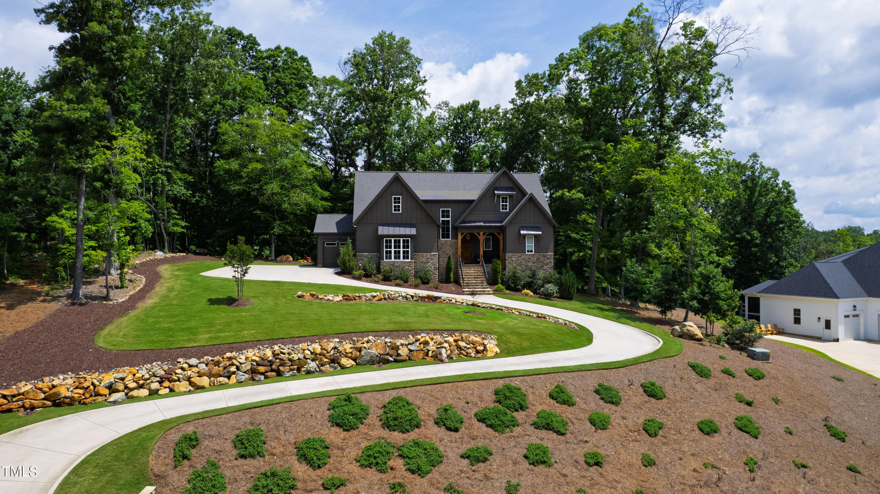 541 Sunset Grove Drive Pittsboro, NC 27312 - Photo 64 of 75 a front view of a house with a garden