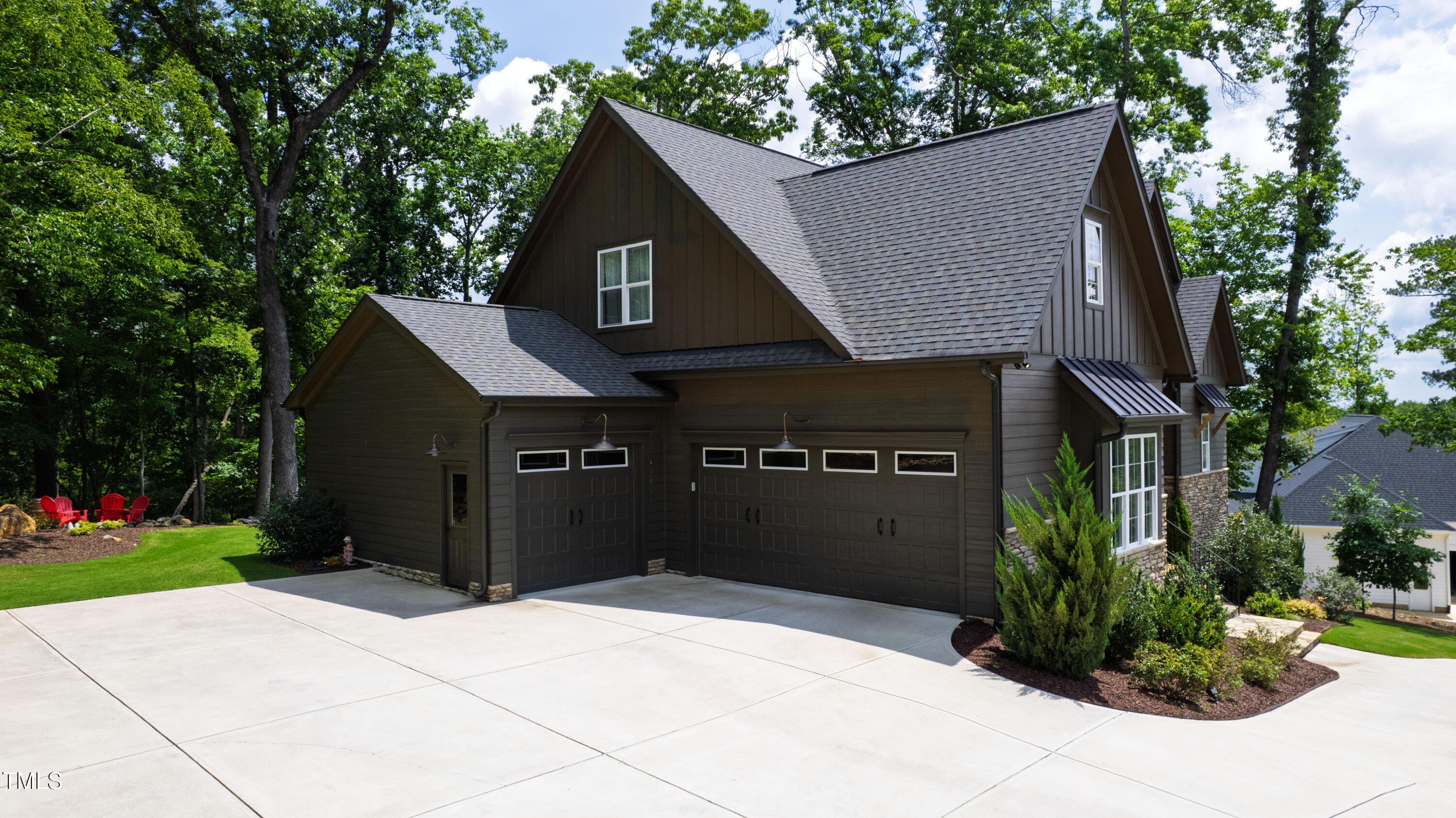 541 Sunset Grove Drive Pittsboro, NC 27312 - Photo 66 of 75 a front view of a house with a yard and trees