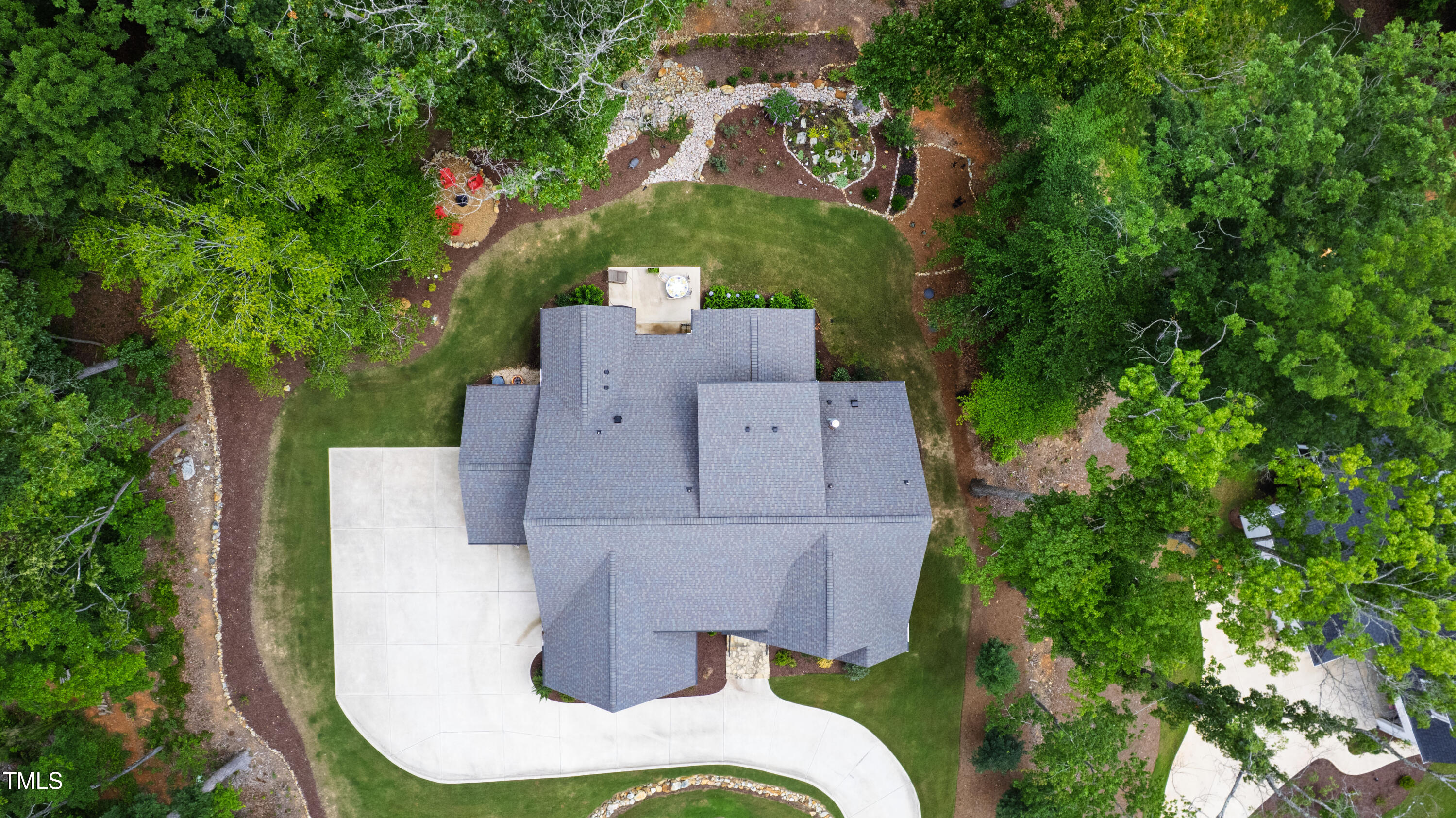 541 Sunset Grove Drive Pittsboro, NC 27312 - Photo 68 of 75 an aerial view of a house with a garden and trees