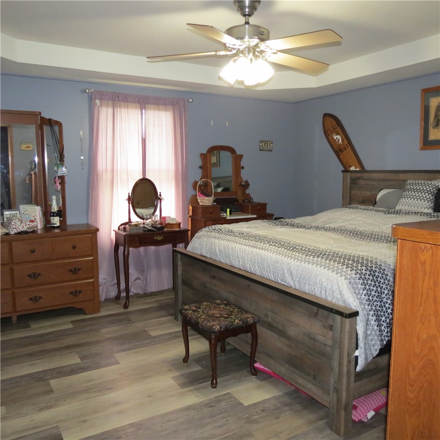 21242 Dingman-Slagle Road Pemberton, OH 45353 - Photo 11 of 33 This spacious bedroom offers ample comfort and style for peaceful living.