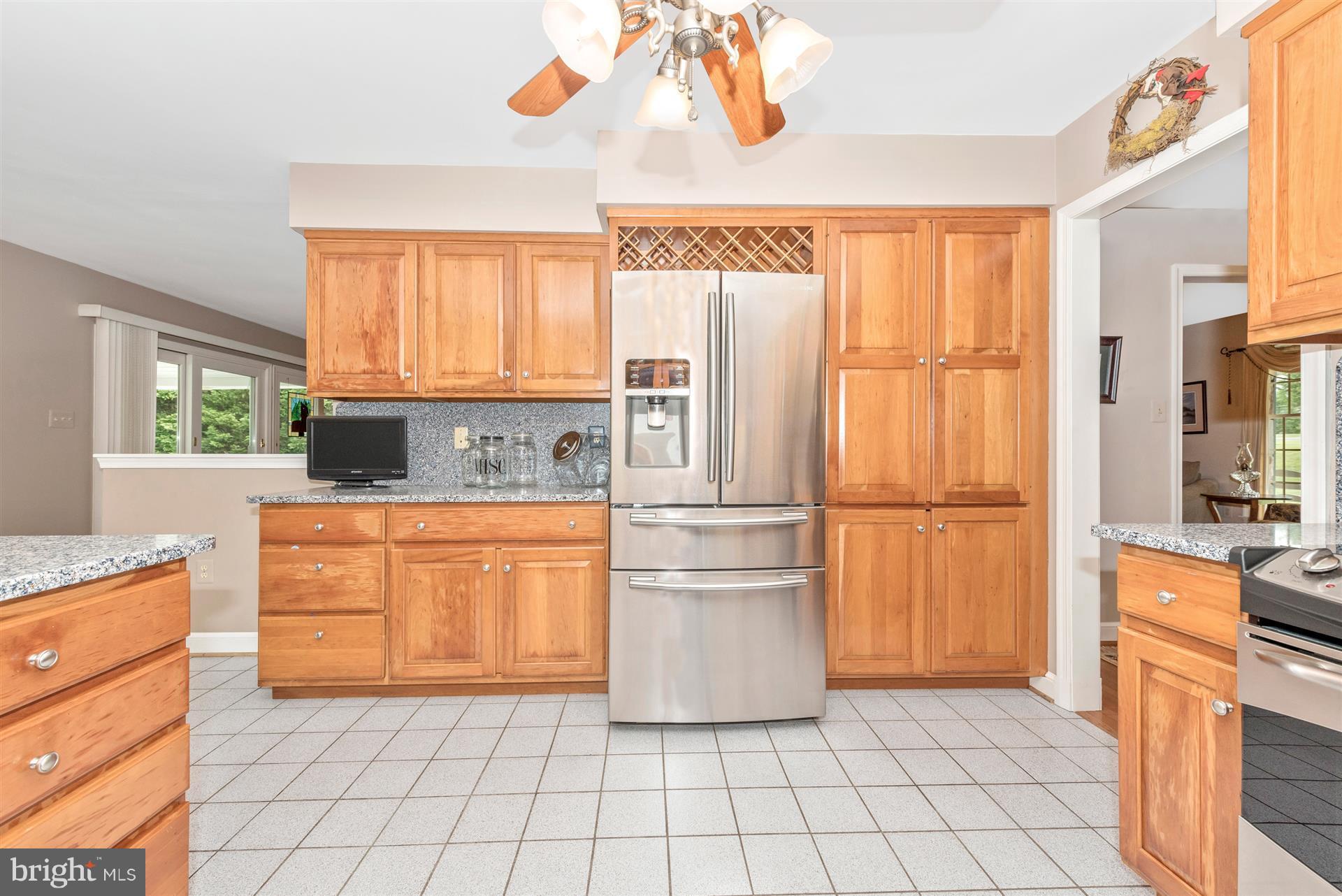 1880 Florence Road Mount Airy, MD 21771 - Photo 11 of 30 a kitchen with granite countertop a refrigerator a sink and dishwasher