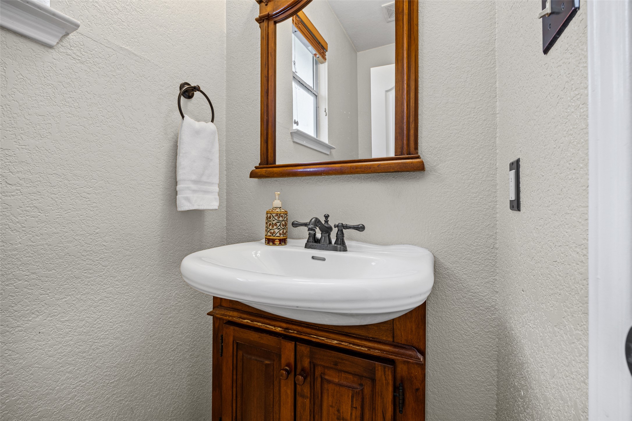 402 Autumn Trail Georgetown, TX 78626 - Photo 12 of 25 a bathroom with a sink a vanity and a mirror