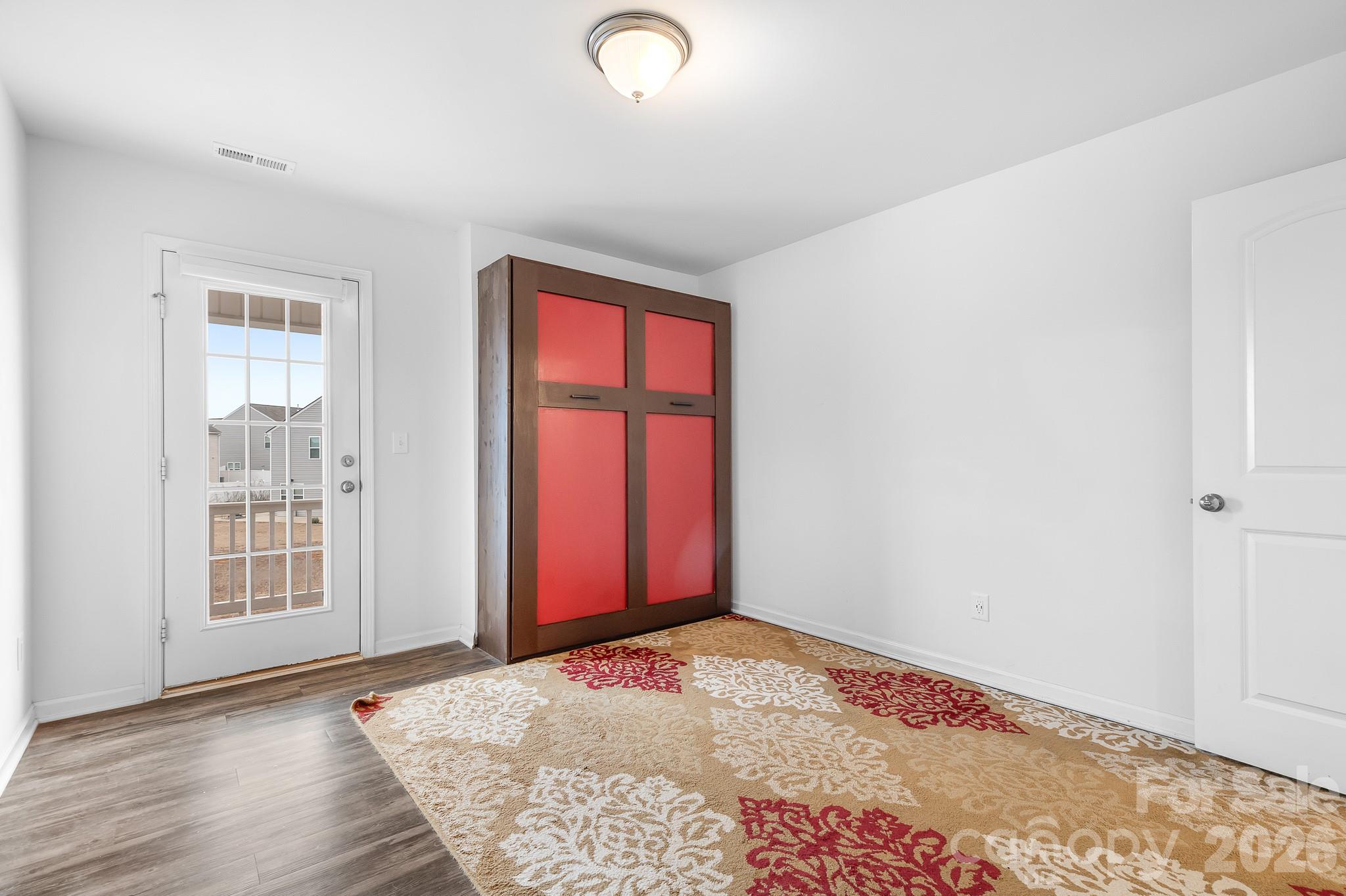 6308 Durango Way Denver, NC 28037 - Photo 25 of 45 an empty room with windows