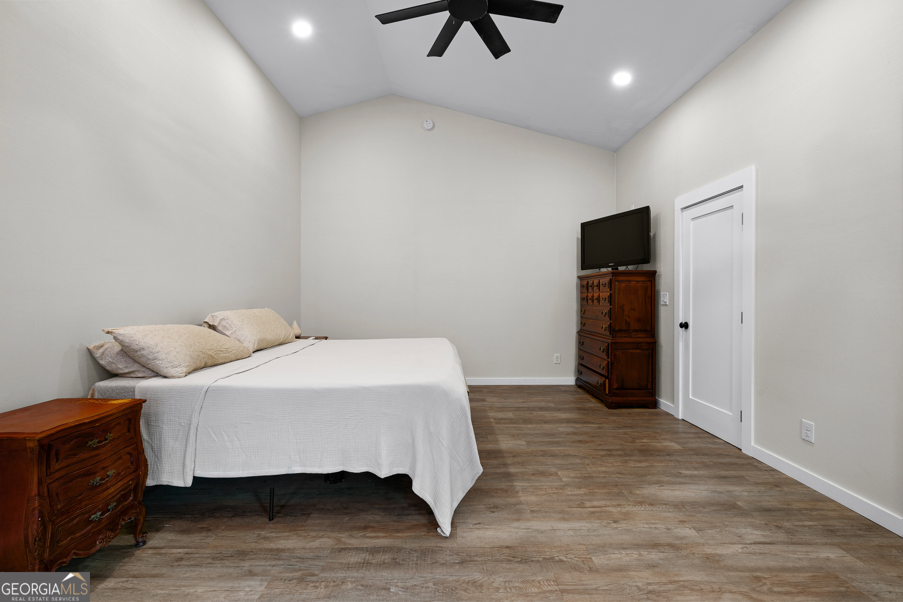 1329 Standing Rock Road Senoia, GA 30276 - Photo 21 of 77 a bedroom with a bed and a television