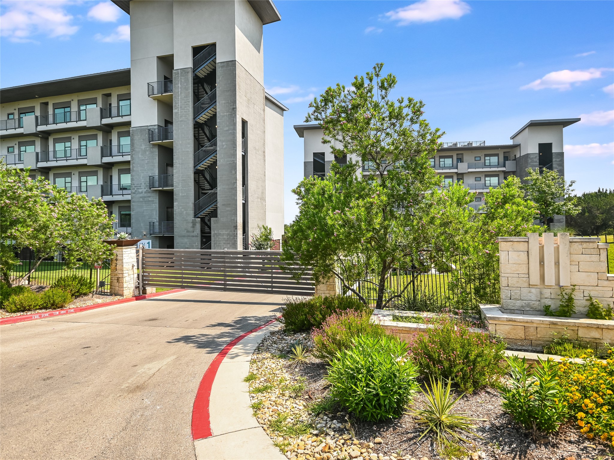 5921 Hiline Road, Unit 1501 Austin, TX 78734 - Photo 3 of 38 a view of a building with a garden