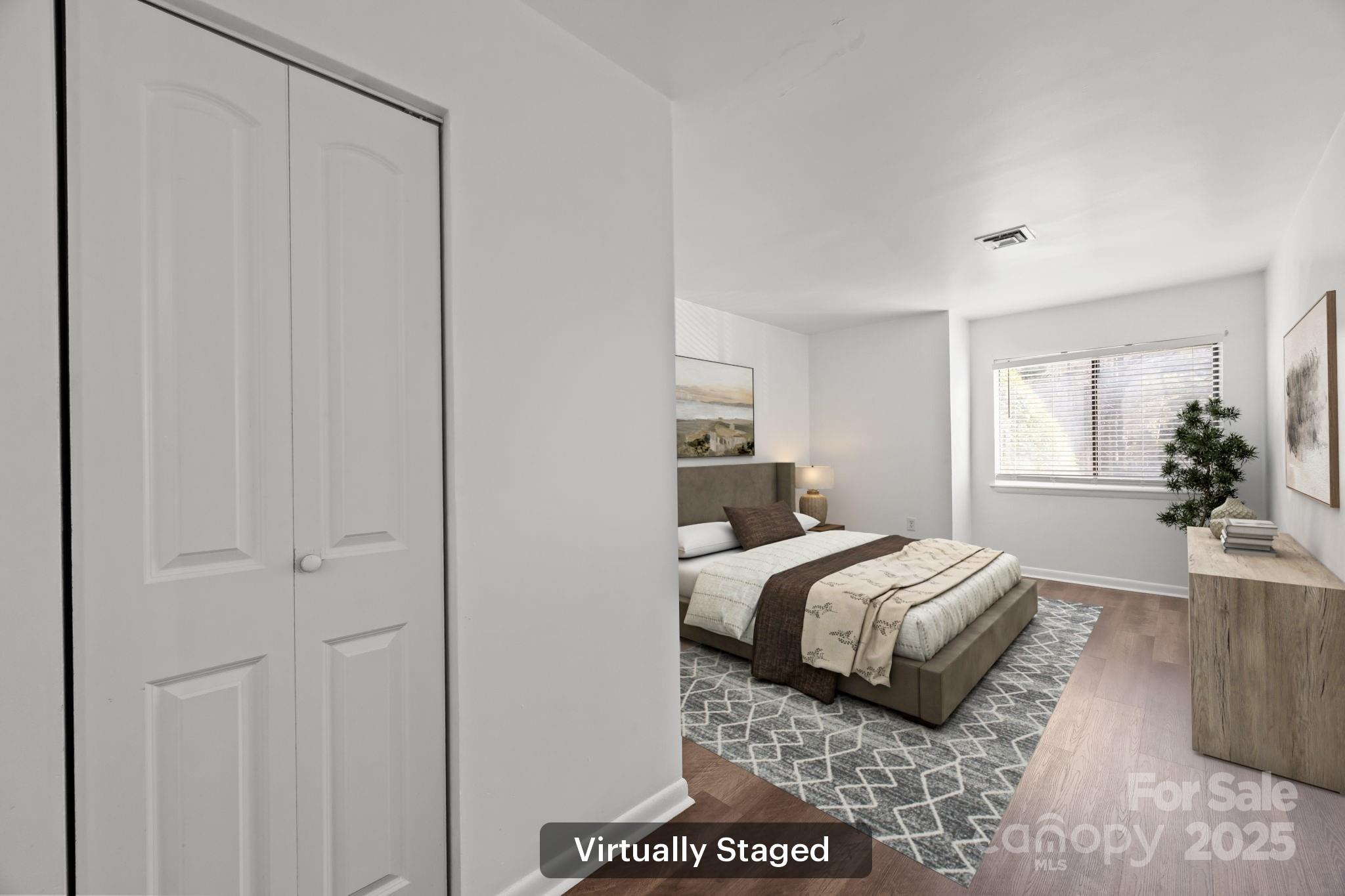 4902 Spring Lake Drive, Unit D Charlotte, NC 28212 - Photo 13 of 30 a bedroom with a bed and window