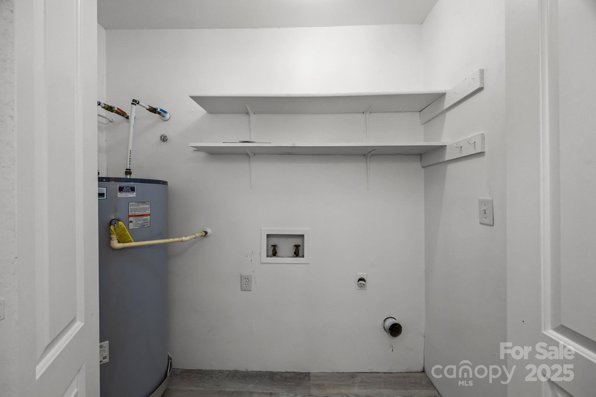 4902 Spring Lake Drive, Unit D Charlotte, NC 28212 - Photo 23 of 30 a view of small space with racks on the wall