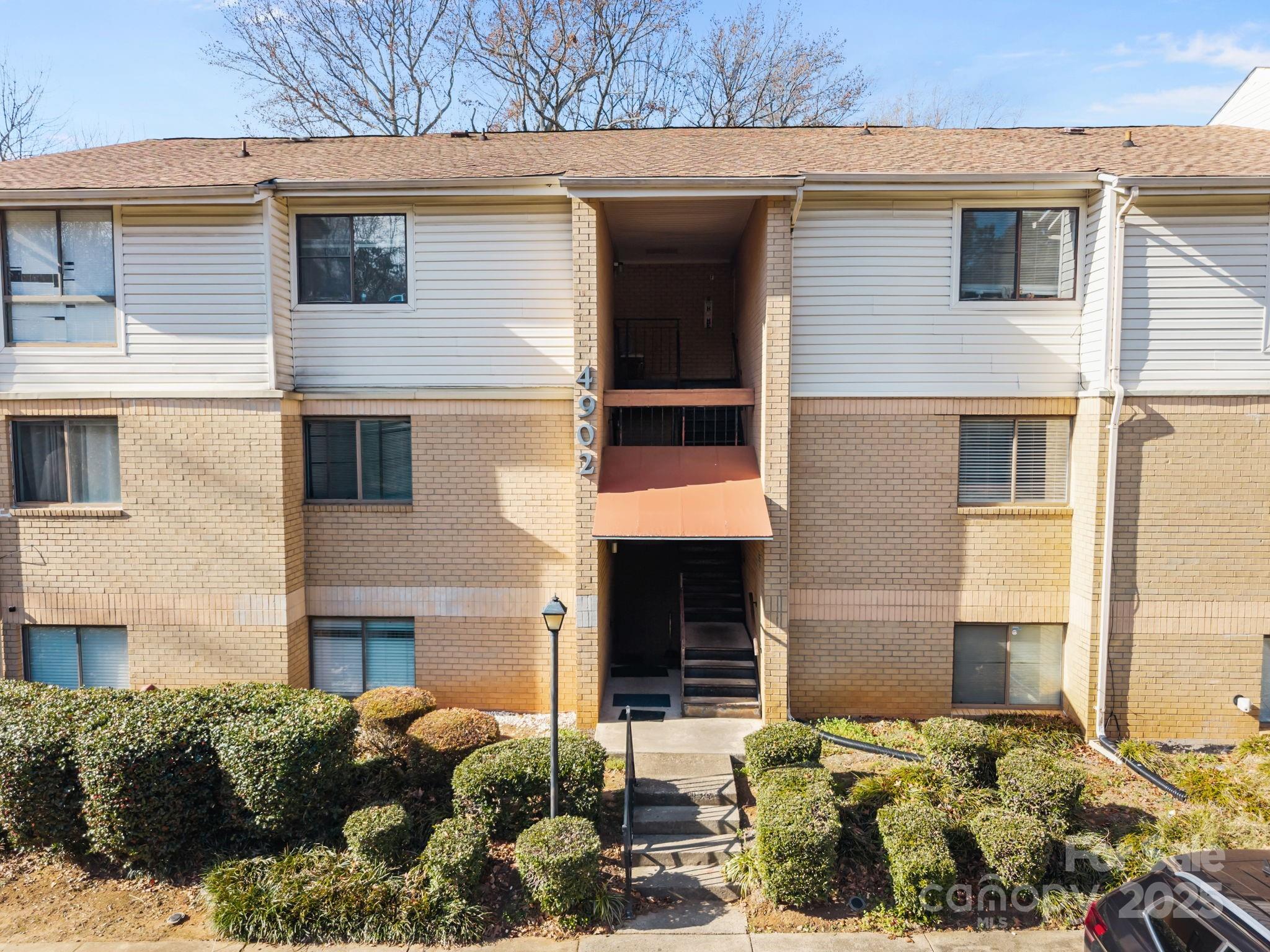 4902 Spring Lake Drive, Unit D Charlotte, NC 28212 - Photo 26 of 30 a view of a house with a yard