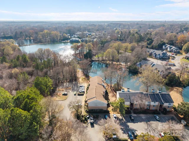 an aerial view of a house with a lake view