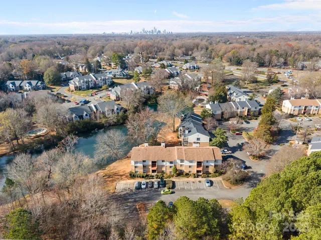 an aerial view of a house with a lake view