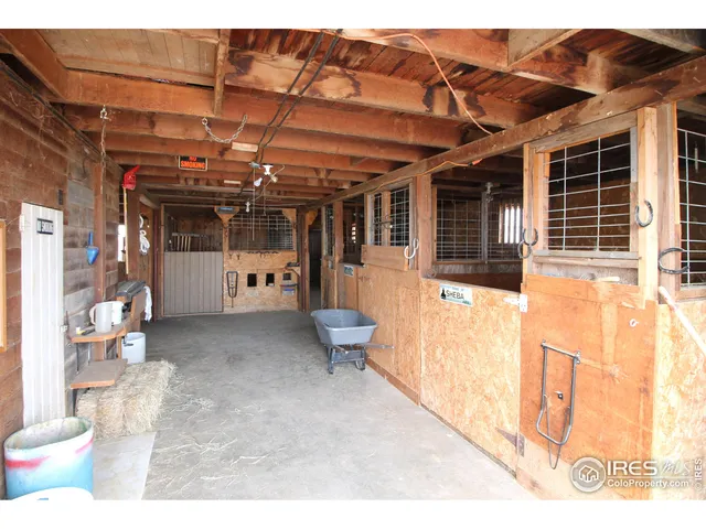 a view of an empty room with a fireplace