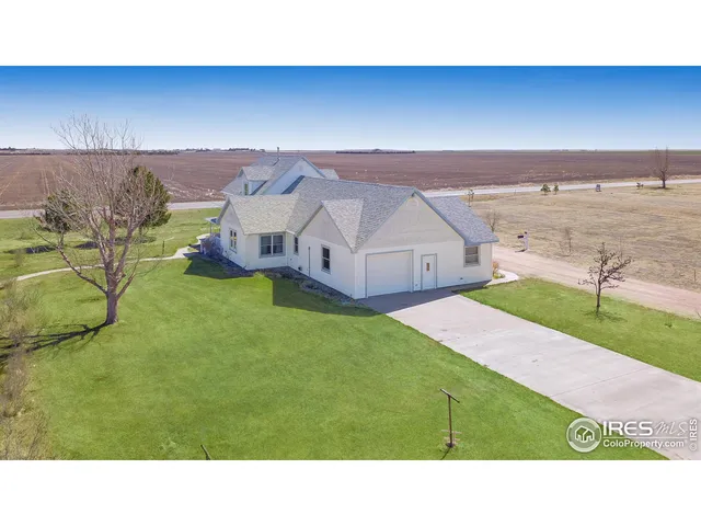 a open area with view of house