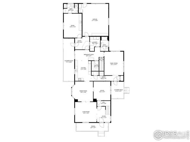 a living room with a large bed and a chandelier