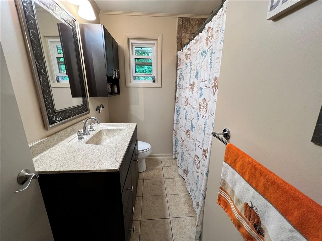 100 Randy Drive Butler, PA 16002 - Photo 13 of 25 a bathroom with a sink and a mirror