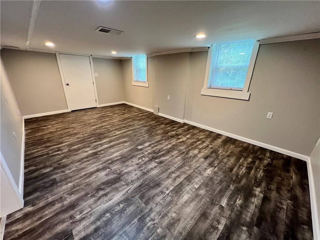100 Randy Drive Butler, PA 16002 - Photo 14 of 25 an empty room with wooden floor and windows