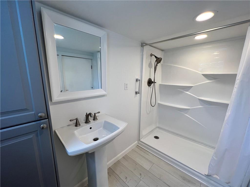 100 Randy Drive Butler, PA 16002 - Photo 19 of 25 a bathroom with a sink and mirror