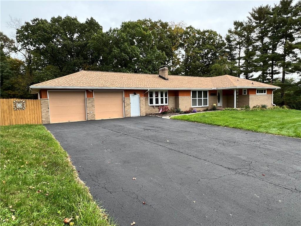 100 Randy Drive Butler, PA 16002 - Photo 20 of 25 a front view of a house with a garden