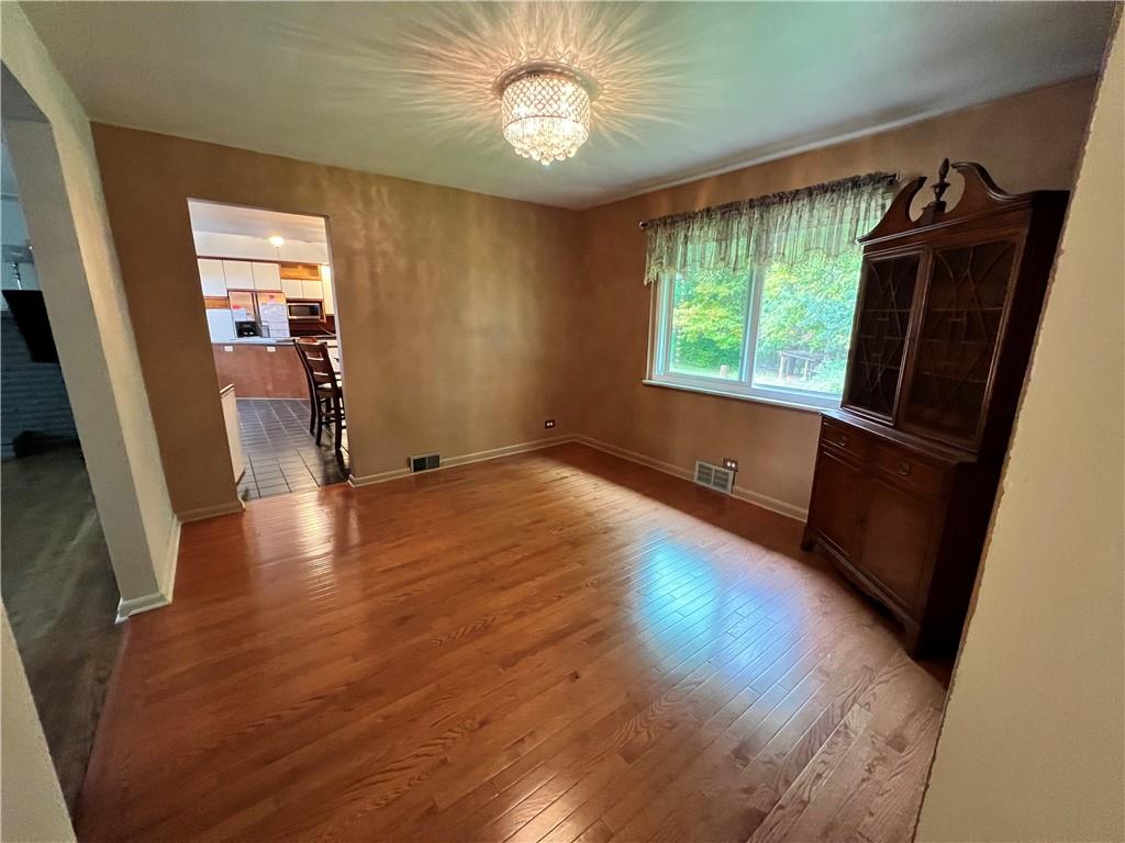 100 Randy Drive Butler, PA 16002 - Photo 4 of 25 wooden floor in an empty room with a window