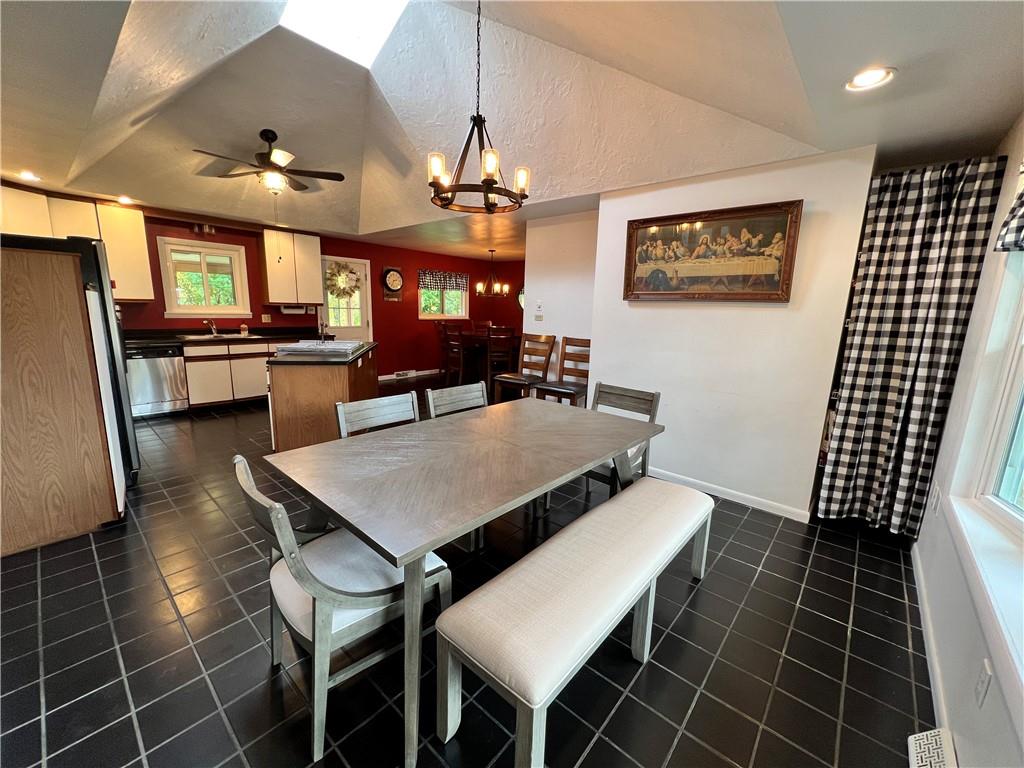 100 Randy Drive Butler, PA 16002 - Photo 7 of 25 a dining room with stainless steel appliances a dining table and chairs