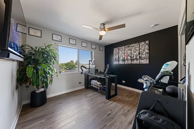 a workspace with furniture and a potted plant