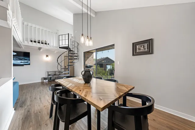 a view of a dining room with furniture and wooden floor