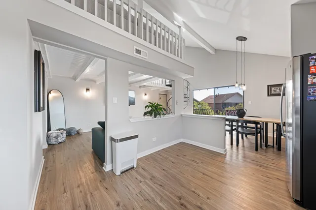 a view of a living room and dining room