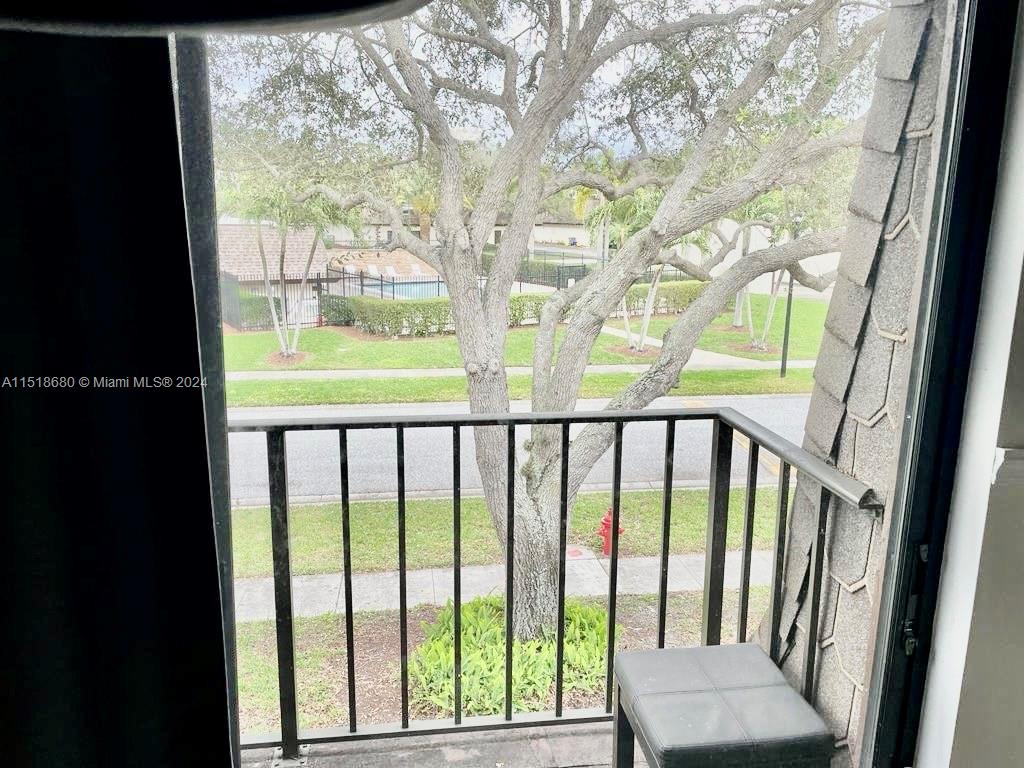 9410 Southwest 61st Way, Unit B Boca Raton, FL 33428 - Photo 23 of 32 a view of balcony with furniture