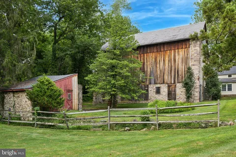 a view of a park with large trees