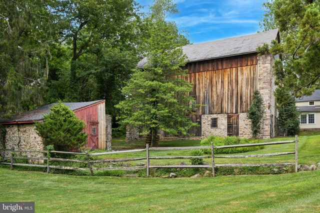 a view of a park with large trees