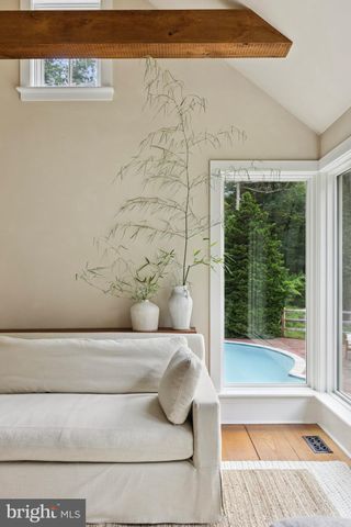 a bathroom with a bathtub and window