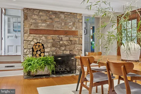 a dining area with a table and chairs
