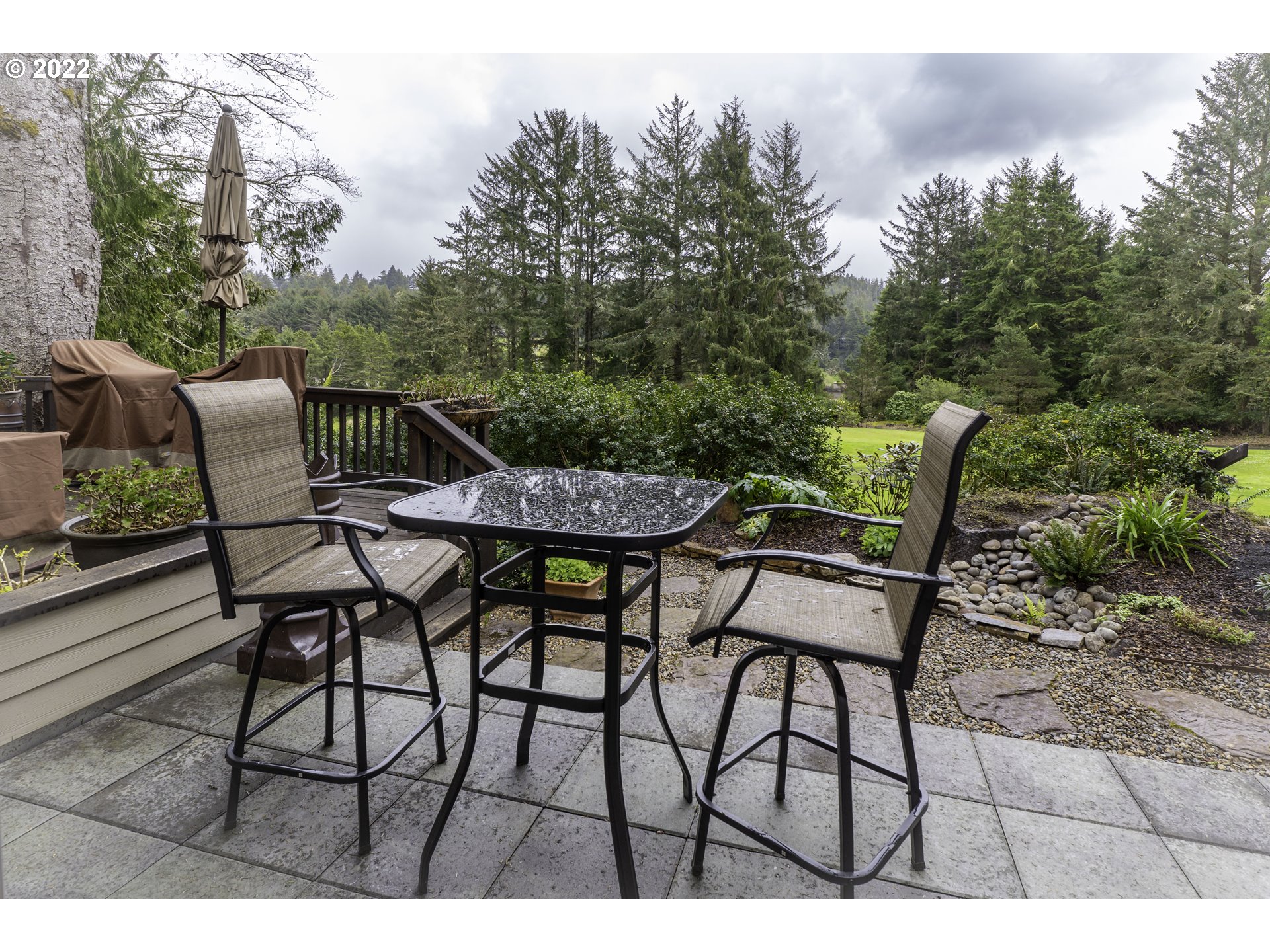104 East Bay Point Road Gleneden Beach, OR 97388 - Photo 22 of 31 a view of a chairs and table in the outdoor