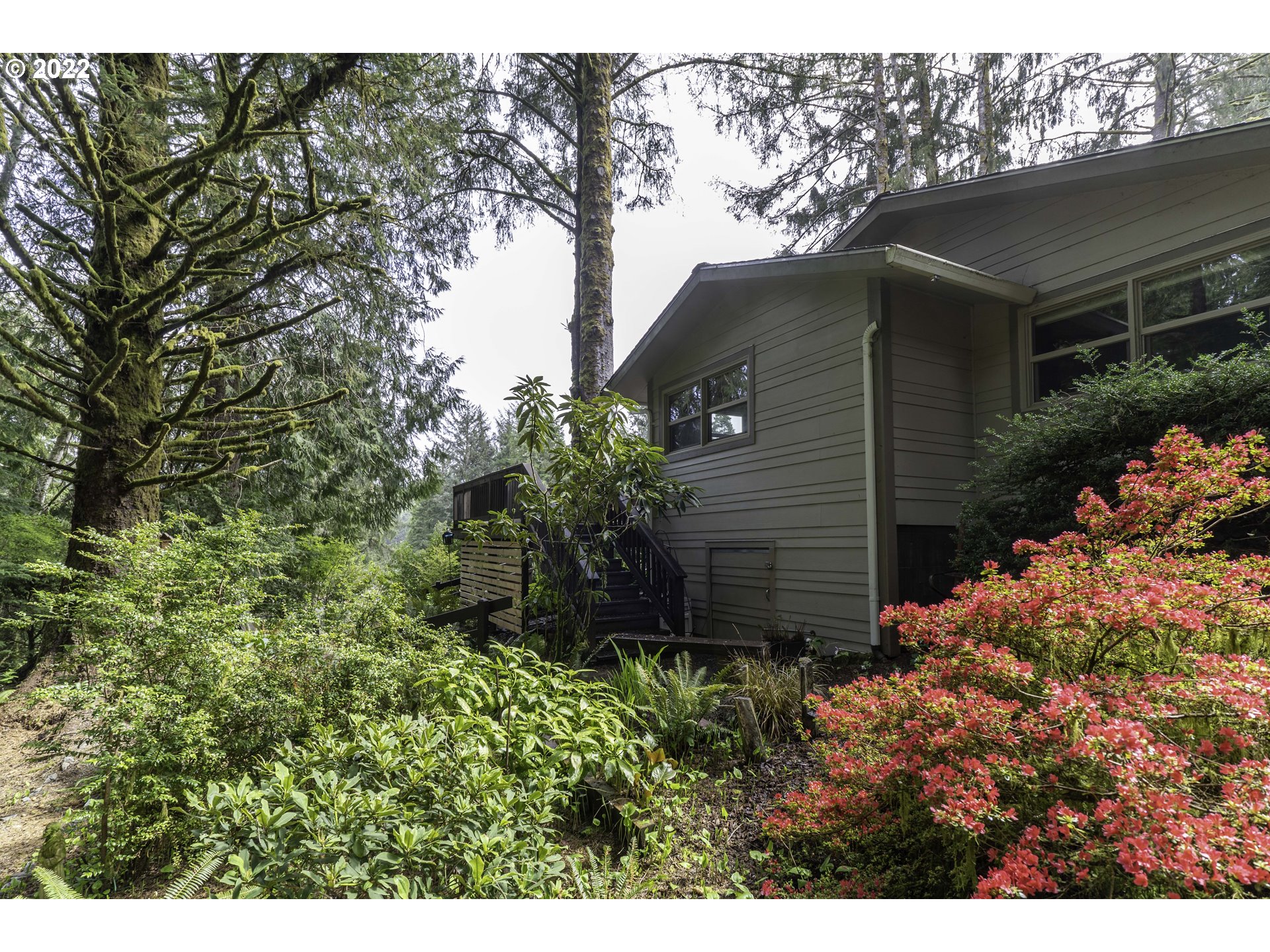 104 East Bay Point Road Gleneden Beach, OR 97388 - Photo 23 of 31 a view of a house with a yard