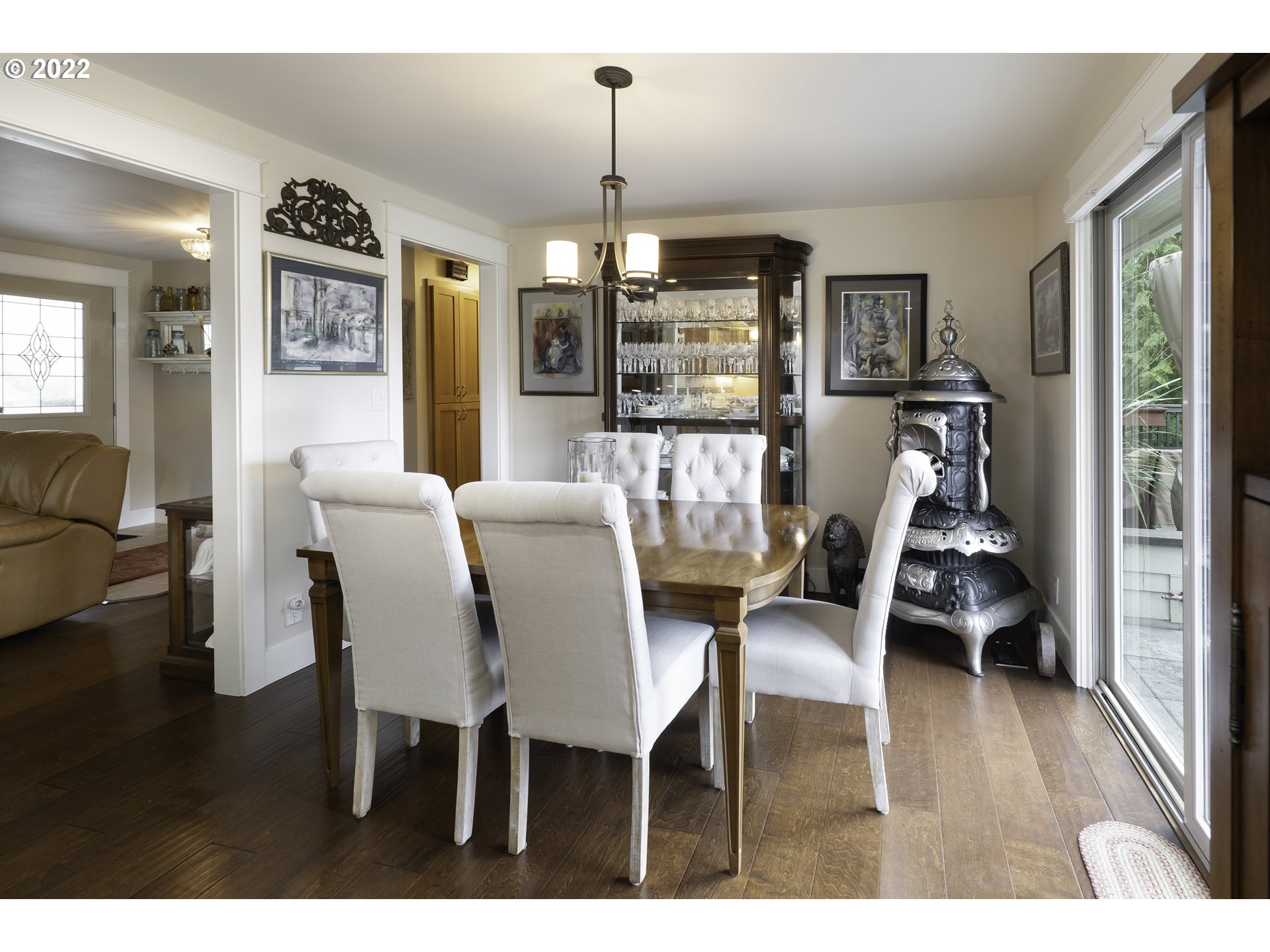 104 East Bay Point Road Gleneden Beach, OR 97388 - Photo 8 of 31 a view of a dining room with furniture wooden floor and chandelier