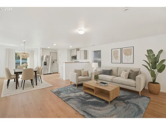 a living room with furniture dining table and a potted plant
