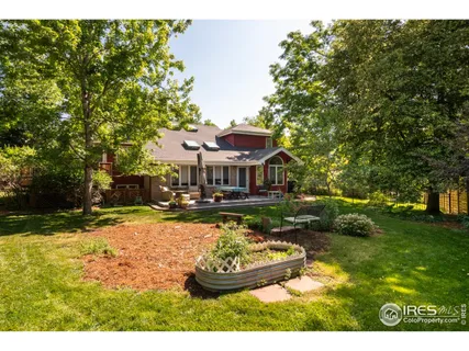 a swimming pool with outdoor seating and yard
