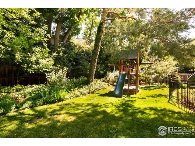 a view of yard with swimming pool
