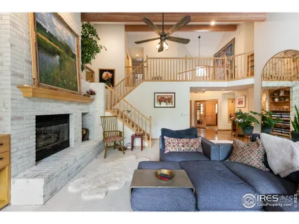 a view of a livingroom with furniture and a fireplace