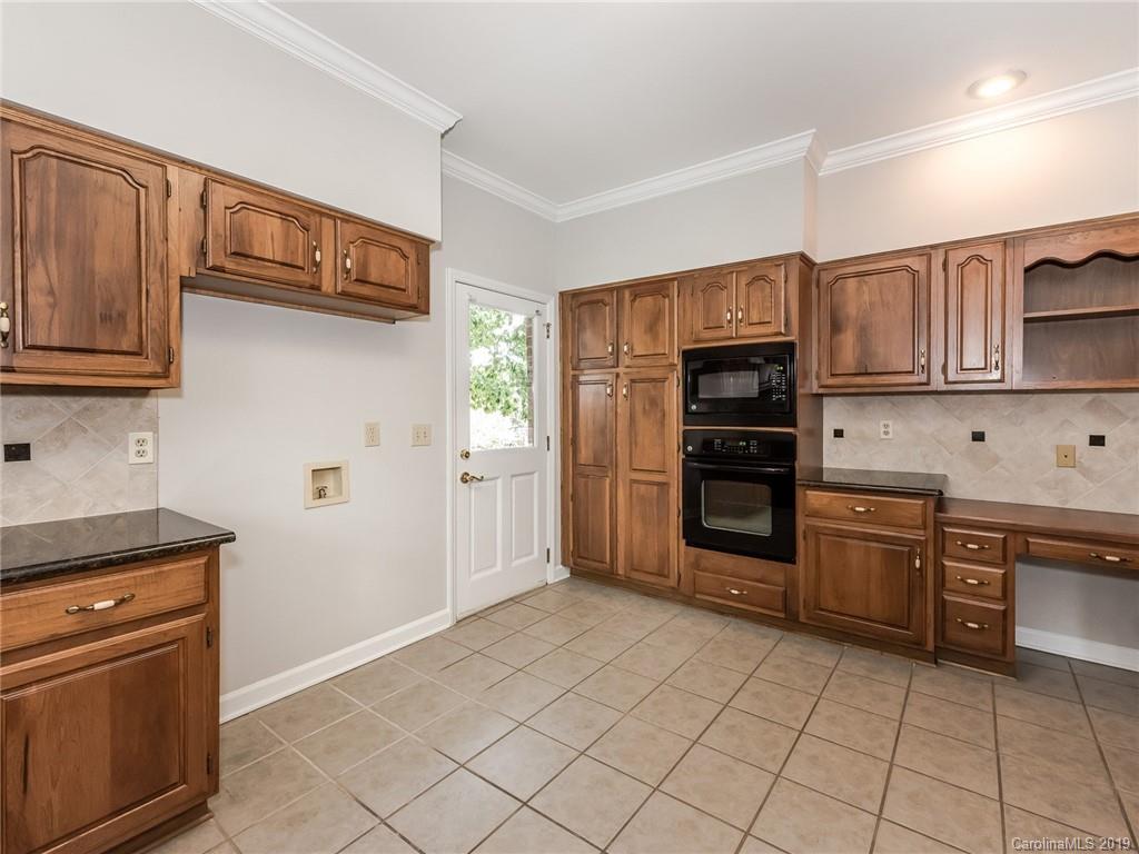 299 South Downs Way Fort Mill, SC 29708 - Photo 14 of 45 a kitchen with stainless steel appliances granite countertop a refrigerator and cabinets