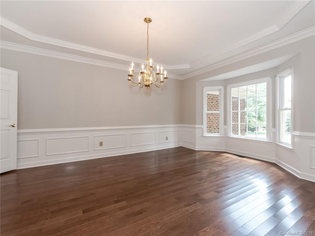299 South Downs Way Fort Mill, SC 29708 - Photo 8 of 45 a view of an empty room with wooden floor and a window