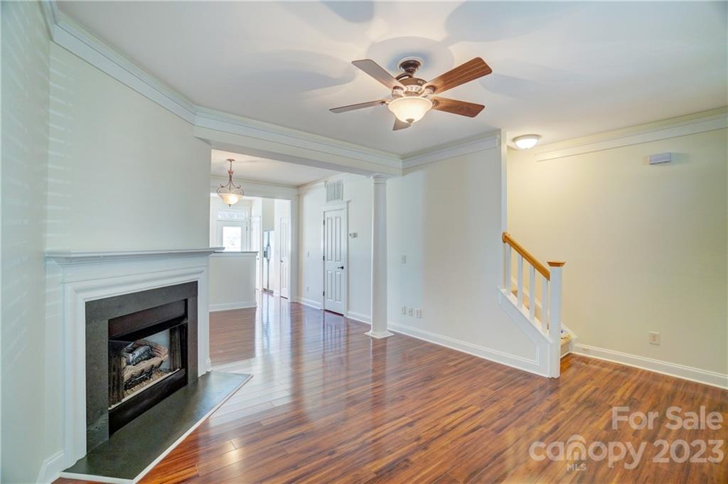 292 Elis Way Fort Mill, SC 29708 - Photo 7 of 22 a view of an empty room with wooden floor and a fireplace
