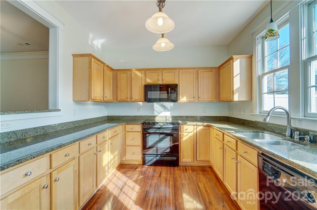 292 Elis Way Fort Mill, SC 29708 - Photo 10 of 22 a kitchen with granite countertop a stove a sink and a granite counter tops
