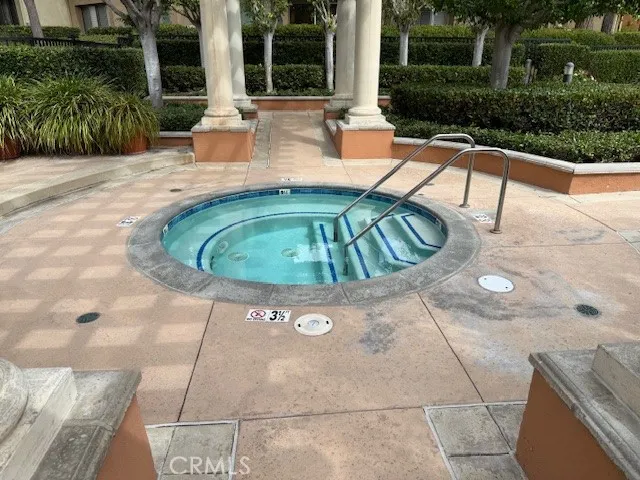 a view of a swimming pool with a patio