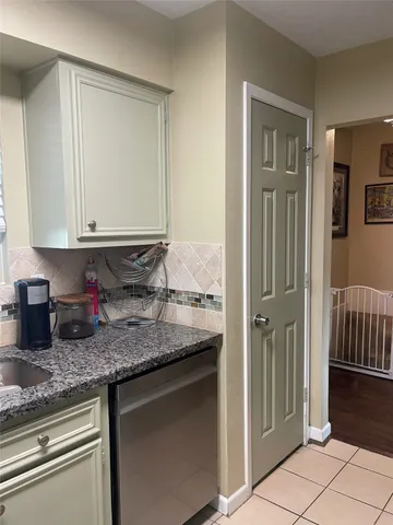 a view of a storage & utility room with a window