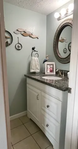 a bedroom with a bed and a mirror