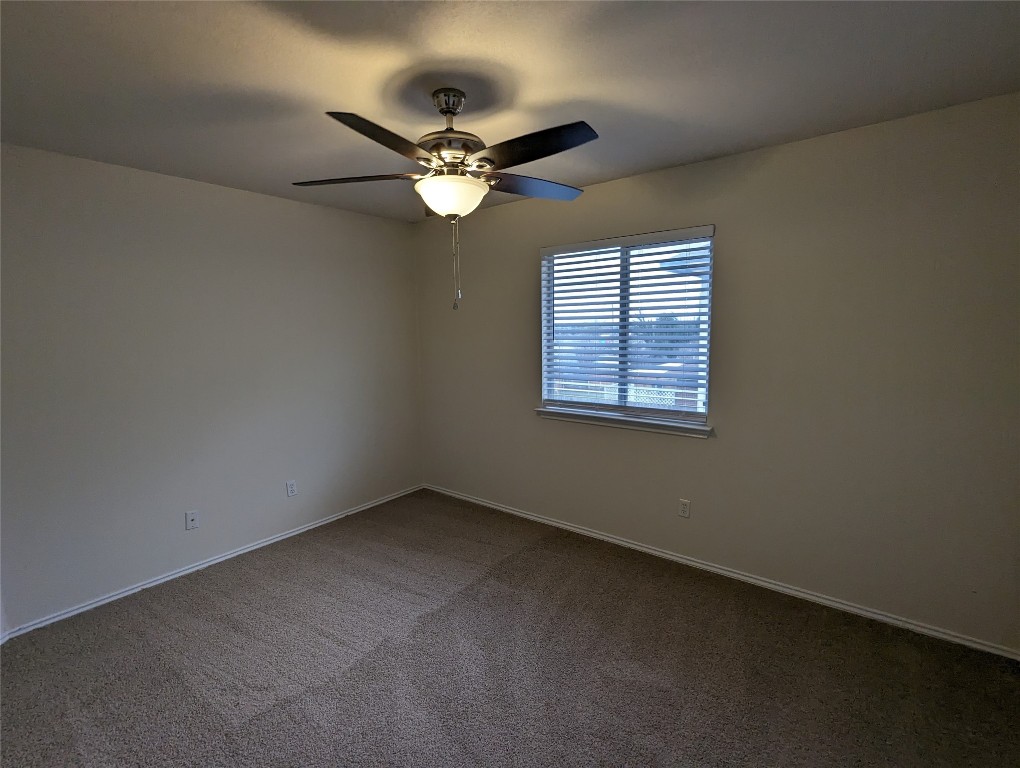 13512 Albania Way Austin, TX 78729 - Photo 17 of 24 an empty room with a window and a fan