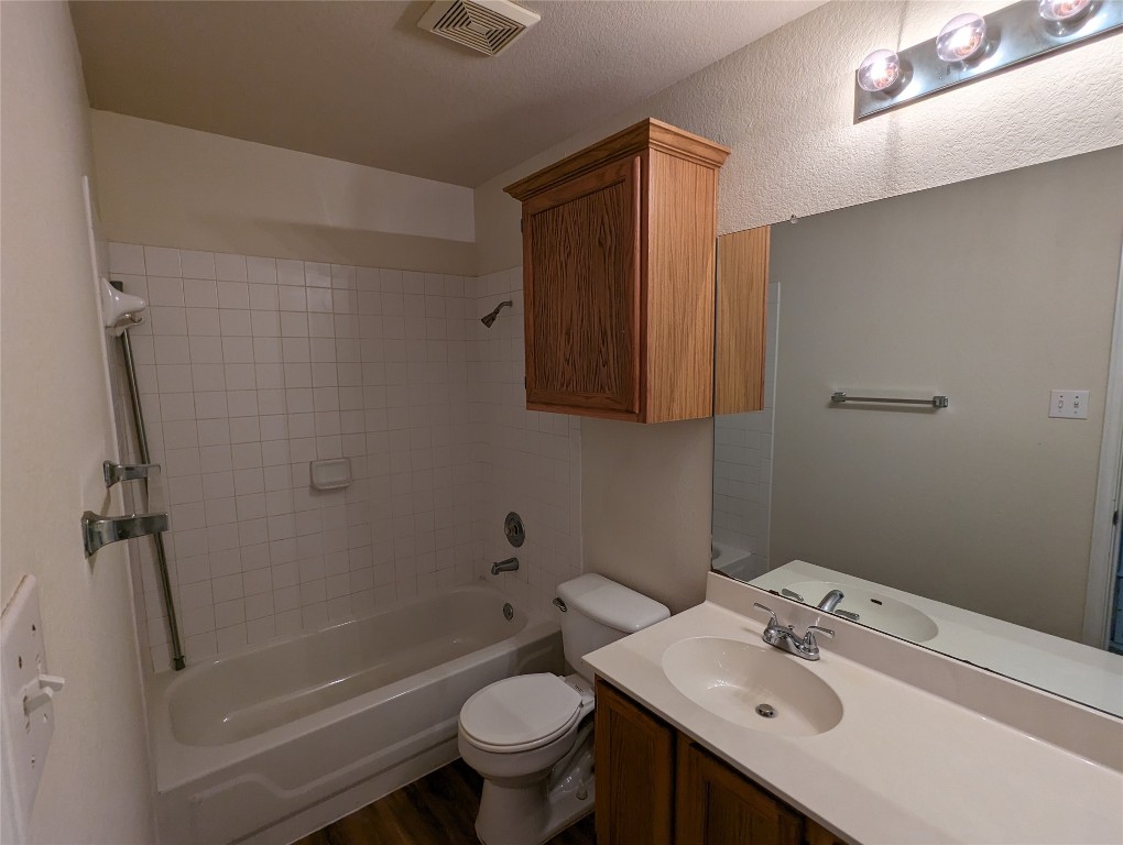13512 Albania Way Austin, TX 78729 - Photo 18 of 24 a bathroom with a sink toilet and shower