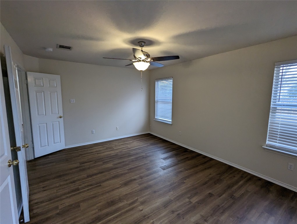 13512 Albania Way Austin, TX 78729 - Photo 10 of 24 wooden floor in an empty room with a window